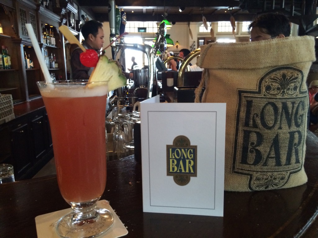 A Singapore Sling at Long Bar at the Raffles Hotel (where it was invented)